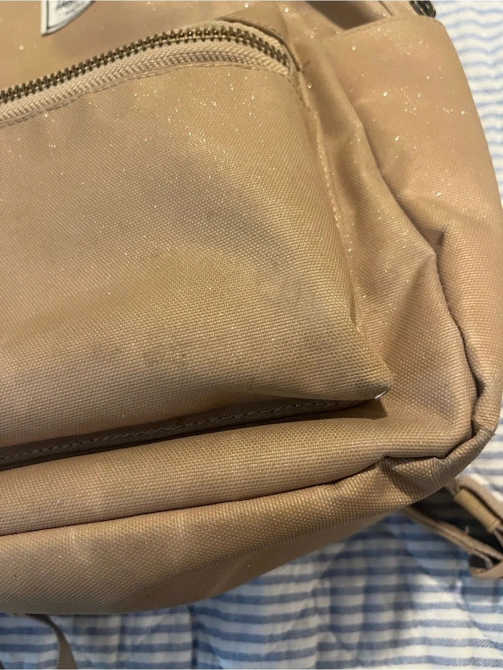 Herschel tan mini backpack